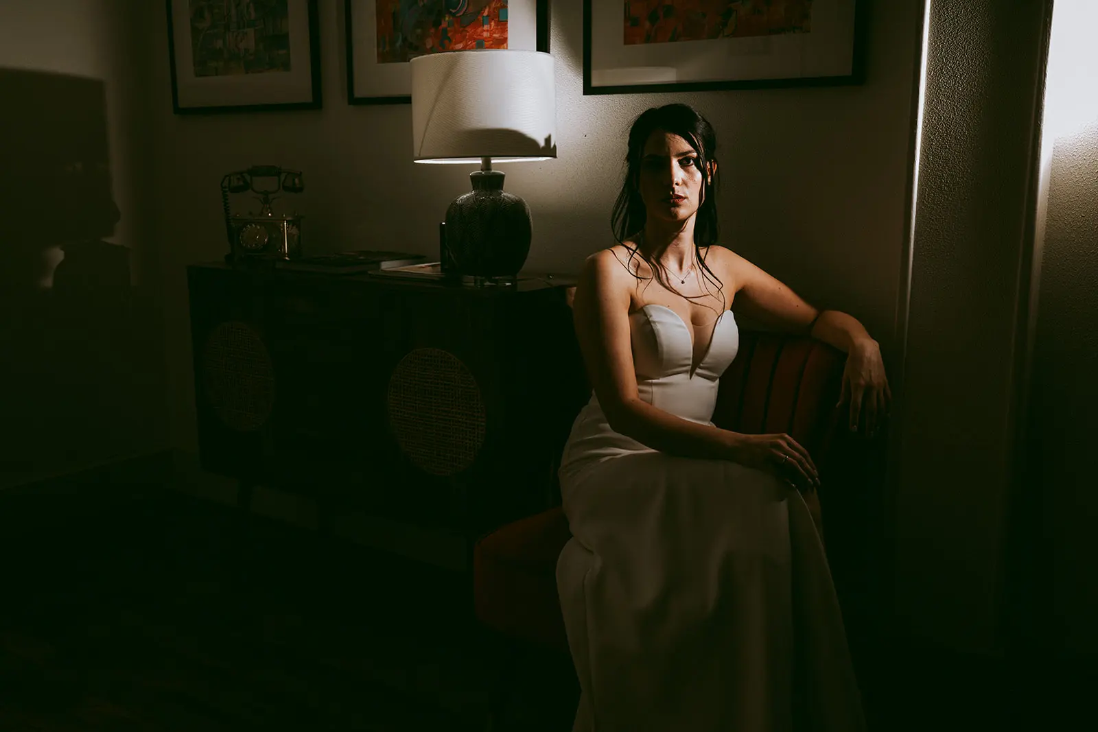 The bride sitting in an armchair before the ceremony