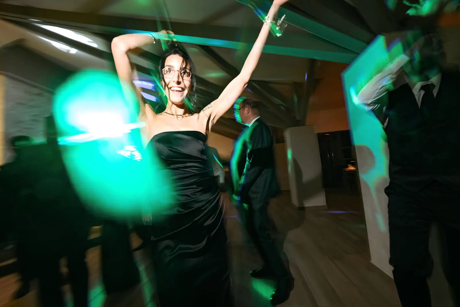 The bride dancing under green party lights
